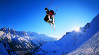 Skier air mountain range sun - a bright sun in the background free wallpaper