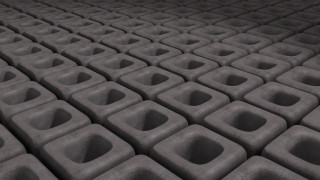 Cement blocks holes black background - a white light in the middle free wallpaper