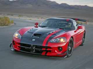 Red black sports car mountains - a cloudy sky above free wallpaper