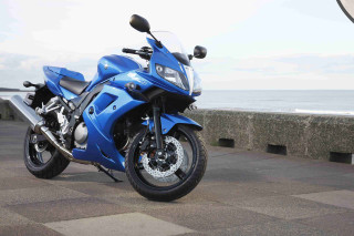 Blue motorcycle sidewalk ocean stone - a blue motorcycle free wallpaper