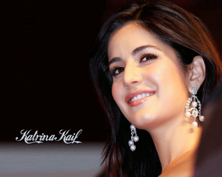 Smiling woman earrings black background - her ear free wallpaper for desktop