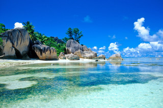Beach rocks clear water blue - rock free wallpaper