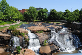 Waterfall park people walking building - a clock tower free wallpaper