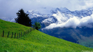 Grassy hill fence mountain clouds 4 - a grassy hill free wallpaper