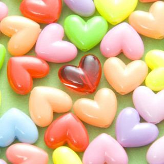 Heart shaped candies green surface 2 - microscopic free wallpaper