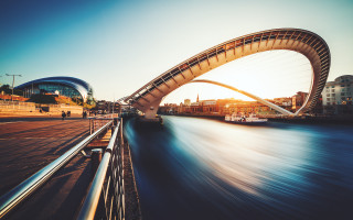 Bridge river boat city buildings - a bridge over a river free wallpaper