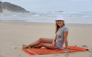Woman beach towel smiling camera - beach free wallpaper