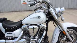 White motorcycle parked building sign - front free wallpaper