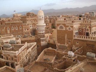 Middle eastern cityscape tower mountains - a tower free wallpaper