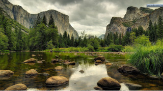 River rocks grass mountains cloudy 2 - the middle of it free wallpaper