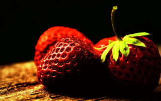 Strawberries wooden surface green leaf - top of them free wallpaper