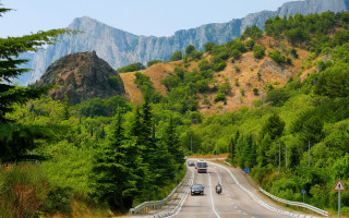 Road mountain cars landscape blue - a mountain in the distance free wallpaper