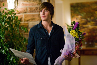 Man holding bouquet flowers paper - his hand in front of him free wallpaper