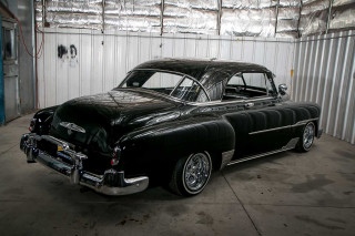 Black car garage corrugated foil - a black car free wallpaper