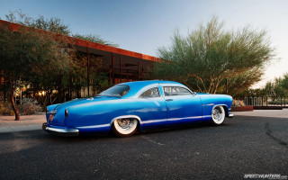 Blue car parked building trees - don eddy free wallpaper