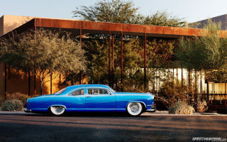 Blue car parked building tree - a large window free wallpaper