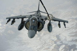 Fighter jet flying mountains snowy - 100mm free wallpaper