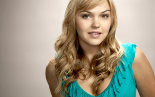 Blonde woman smiling hyperrealism portrait - a blue top free wallpaper