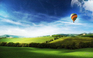 Hot air balloon over green - a full moon in the distance free wallpaper