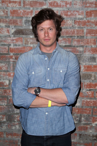 Man standing brick wall arms - front of him free wallpaper