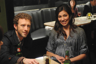 Man woman beer table smile - a man and a woman sitting free wallpaper