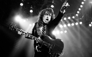 Man guitar stage lights arms - a guitar free wallpaper