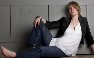 Woman sitting floor legs crossed 8 - jeans free wallpaper