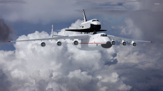 Space shuttle flying clouds space - epic scale free wallpaper