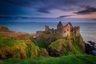 Castle cliff ocean sunset cloudy - blue sky above free wallpaper