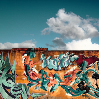 Graffiti wall sky background clouds 2 - a wall free wallpaper