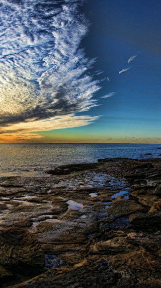 Rocky shore water clouds rocks - a few rock below free wallpaper