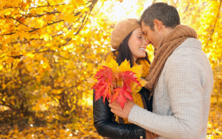 Man woman hugging fall leaves - yellow leaf free wallpaper