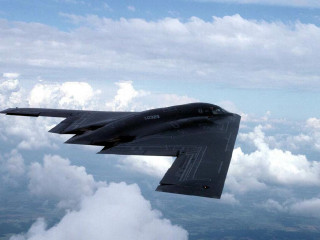 Jet flying cloud filled sky - a jet free wallpaper