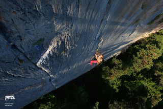 Man climbing steep cliff red - steep free wallpaper