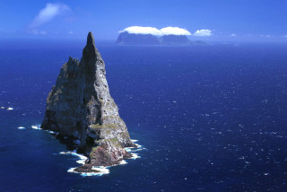 Large rock ocean mountain boat - a large rock free wallpaper