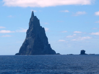 Large rock formation ocean boat 2 - a photo free wallpaper