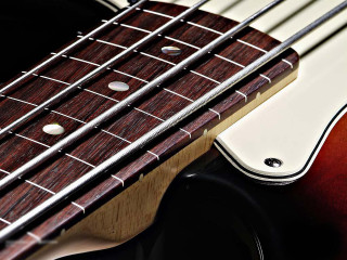 Guitar neck strings closeup black - a close up of a guitar neck free wallpaper