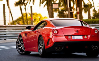 Red sports car palm trees - a parking meter free wallpaper