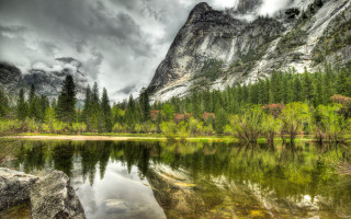 Mountain lake trees rocks cloudy - a mountain lake free wallpaper