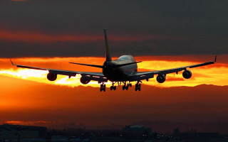 Plane flying sunset clouds city - sunset free wallpaper
