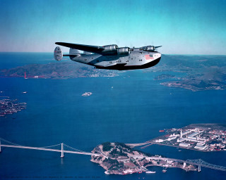 Plane flying water bridge city - near free wallpaper