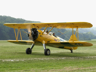 Yellow airplane propeller grass field - a propeller free wallpaper