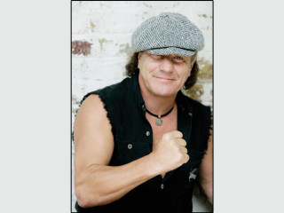 Man hat black vest white - a white brick wall free wallpaper