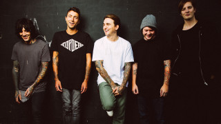 Men tattoos standing wall group - a group of men free wallpaper