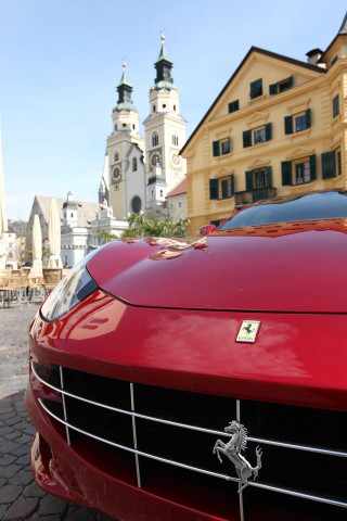 Red ferrari clock tower building - front free wallpaper