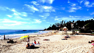 Beach people yellow umbrella sand - a yellow umbrella free wallpaper