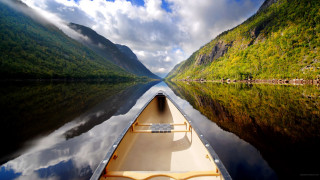 Boat river mountains clouds sky 4 - arthur quartley free wallpaper