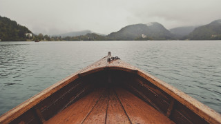 Boat water mountains bird perched - the background and a bird free wallpaper