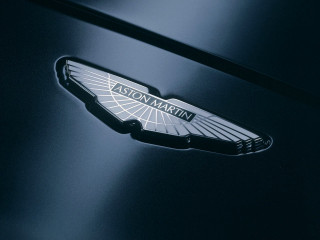 Car badge closeup dark room - andrew law free wallpaper