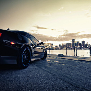 Black sports car water city - near free wallpaper